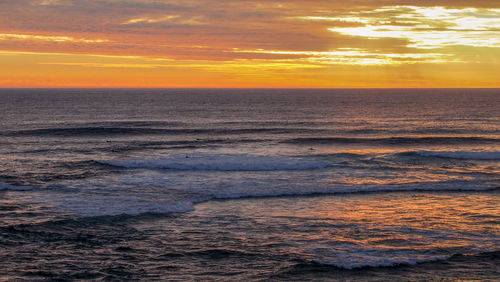 Scenic view of sea against sky during sunset