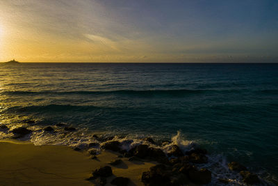 Scenic view of sea against sky during sunset