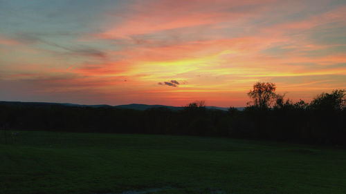 Scenic view of landscape against sky during sunset