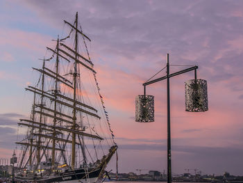 Low angle view of sailboat against sky at sunset