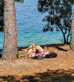 People relaxing on beach