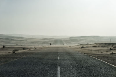 View of country road against clear sky