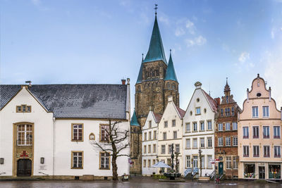 Buildings in city against sky