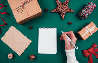 High angle view of christmas paper on table