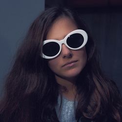 Close-up portrait of woman wearing sunglasses