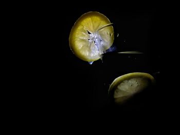 Close-up of drink on table against black background