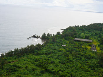 High angle view of trees and sea against sky