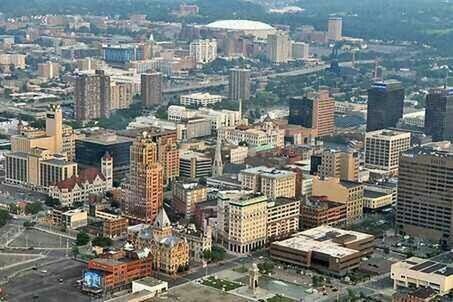 building exterior, cityscape, architecture, city, built structure, crowded, high angle view, skyscraper, residential district, aerial view, residential building, tower, office building, residential structure, city life, modern, tall - high, capital cities, outdoors, financial district