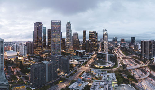 High angle view of modern buildings in city against sky