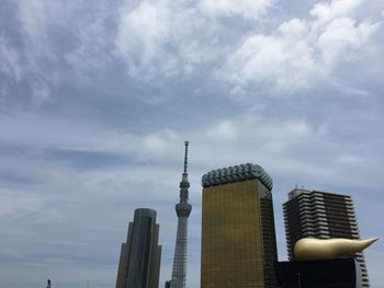 Low angle view of skyscraper against sky