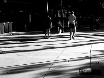People walking on street in city