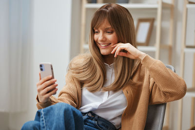 Young woman using mobile phone