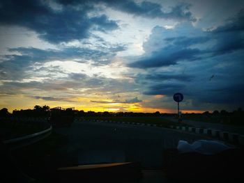 Silhouette city against sky during sunset