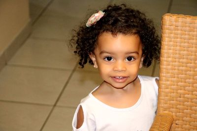 Portrait of cute girl smiling at home