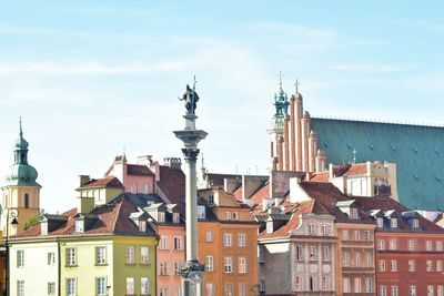 Buildings in city against sky