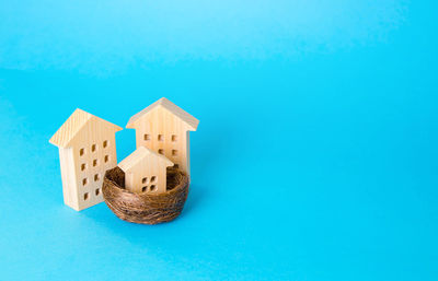 Close-up of model house on blue background