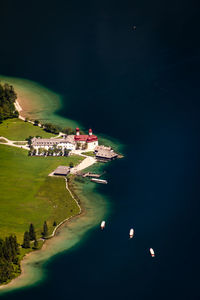 Aerial view of built structure by sea