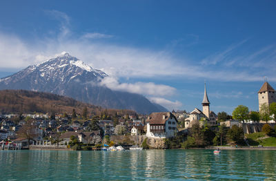 Landscape of thun with historical buildings and blue sky background and have lake thun located