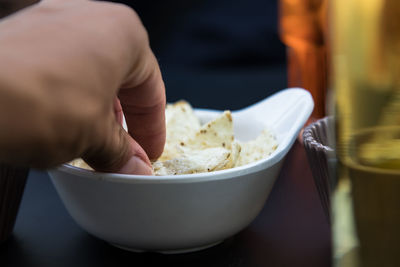 Close-up of hand holding food