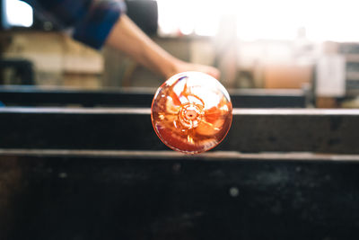 Manual worker making glass at workshop