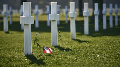 American flag on field at cemetery