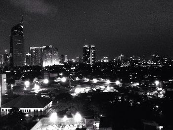 Illuminated cityscape at night