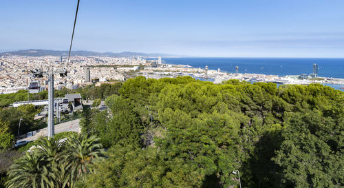 Panoramic shot of city by sea against sky