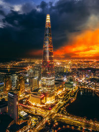 Aerial view of illuminated buildings in city at night