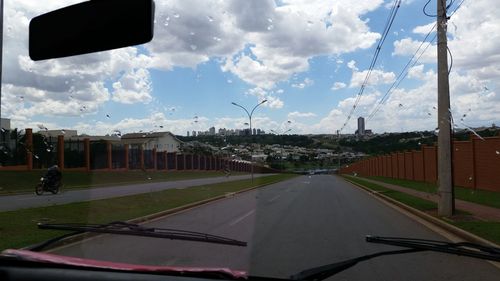 View of road against cloudy sky