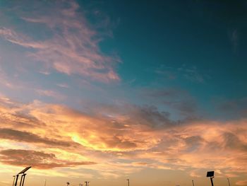 Low angle view of dramatic sky during sunset