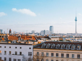 Fernsehturm and buildings against sky