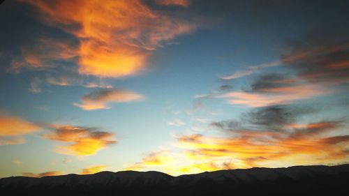 Low angle view of dramatic sky during sunset