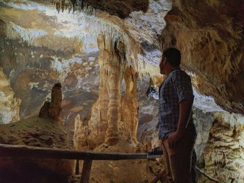 Man standing in cave