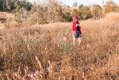 Woman standing on field