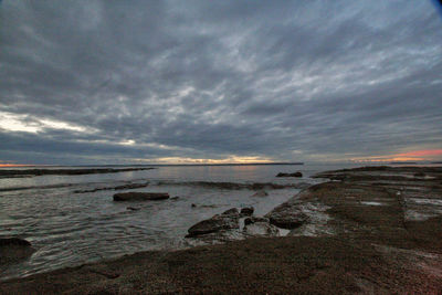 Scenic view of sea against sky at sunset