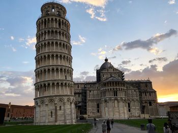 Low angle view of leaning tower of pisa against sky during sunset