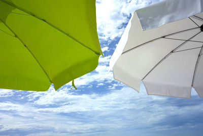 Low angle view of parasol against sky