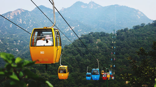 Overhead cable car against mountains