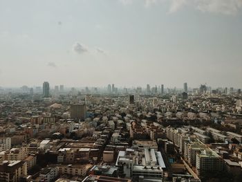 High angle view of buildings in city against sky