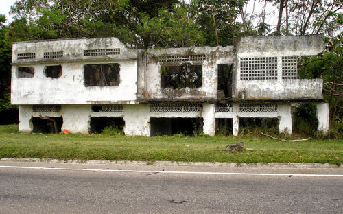 Old building by road in city