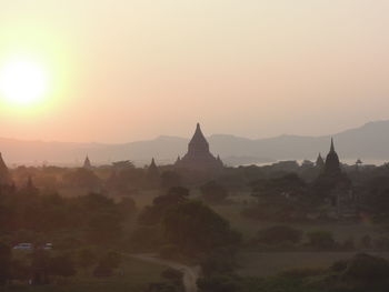 Panoramic view of a temple against sky during sunrise