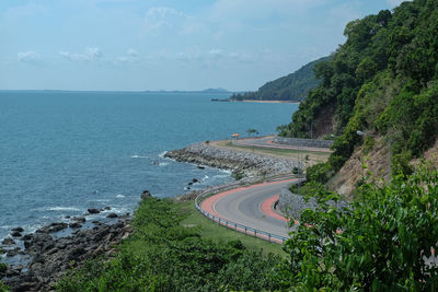 High angle view of road by sea against sky