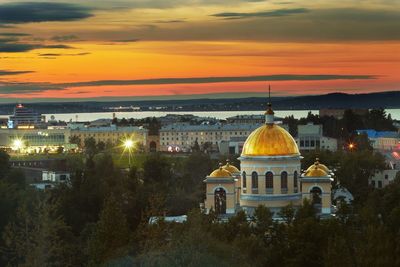 View of illuminated city at sunset