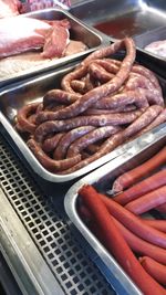 High angle view of meat on barbecue grill