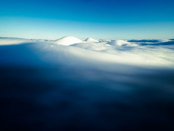 Scenic view of sea against blue sky