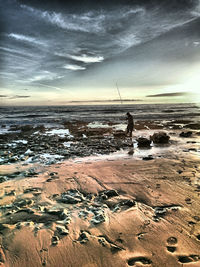 Scenic view of sea against cloudy sky