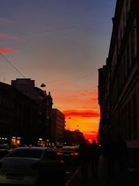 View of city street at sunset