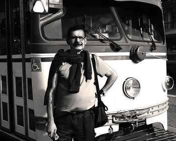 Full length of man standing on bus