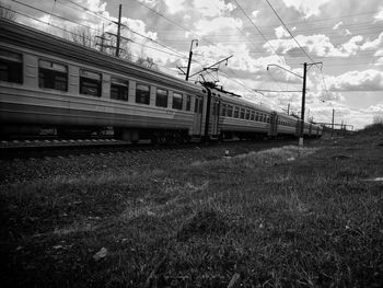 Train on field against sky