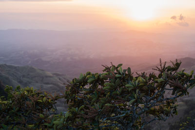 Scenic view of mountains against sky at sunset